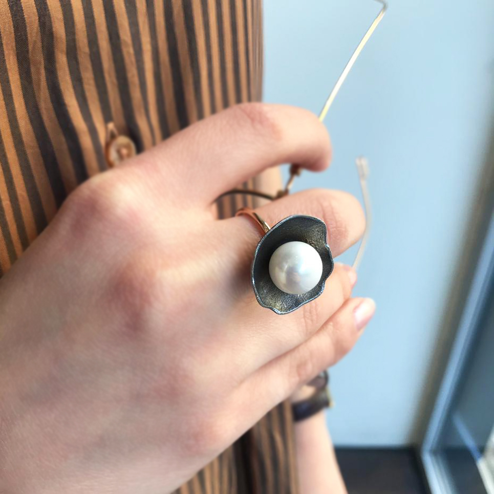 THE SHELL AND IT'S PEARL RING